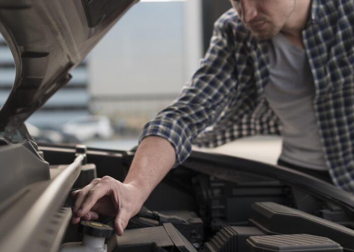 Man fixing car