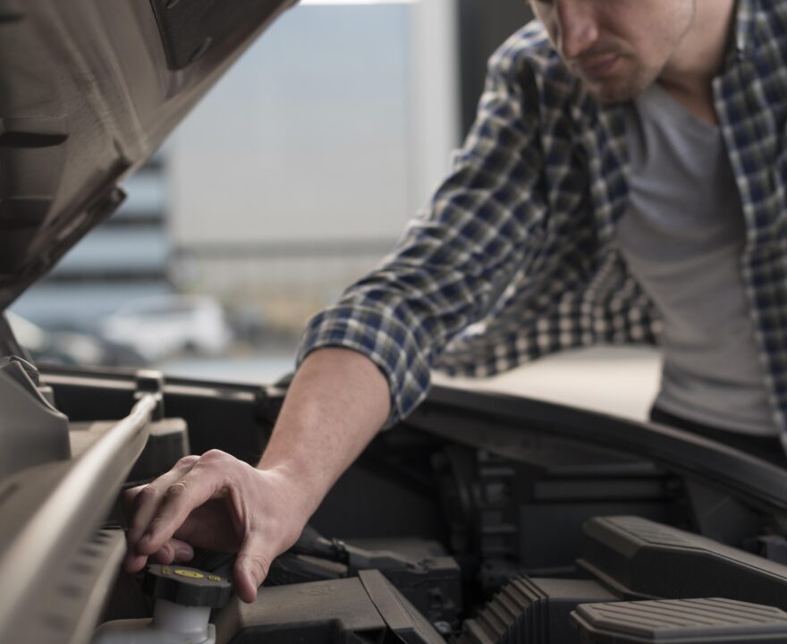 Man fixing car