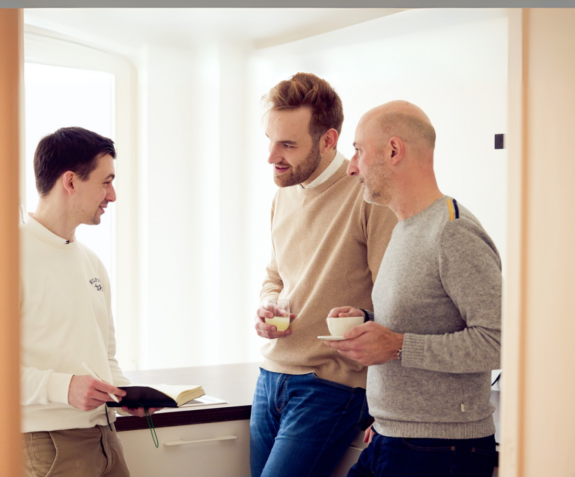 3 Colleagues talking to each other in the coffee corner