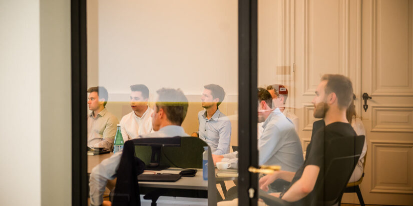 Chronion team having a meeting in the Ghent office