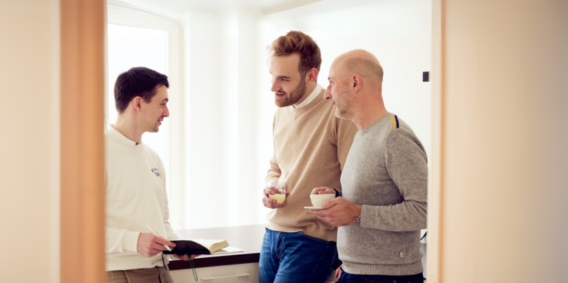 3 Colleagues talking to each other in the coffee corner