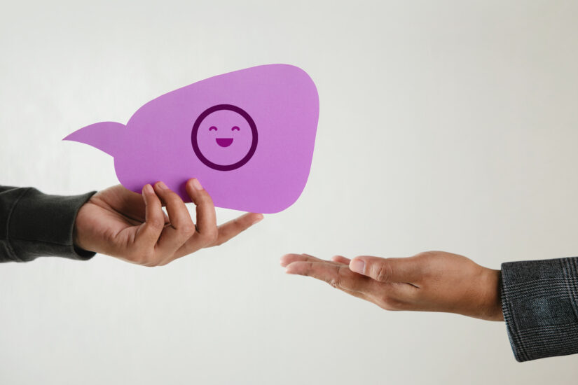 Customer experience concept happy client giving smiling emoticon businessman feedback bubble speech card positive review satisfaction survey